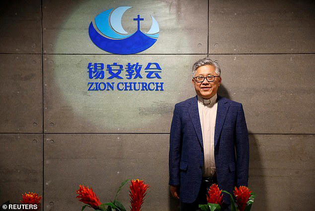 Pastor Jin Mingri (pictured), the founder of Zion Church, was detained at his home in the southern city of Beihai on Friday evening Pastor Jin Mingri (pictured), the founder of Zion Church, was detained at his home in the southern city of Beihai on Friday evening